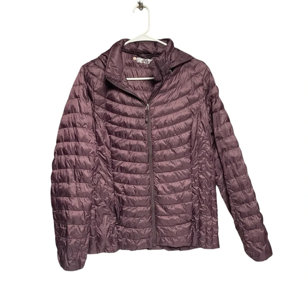 HeatKeep size medium puffer coat dark purple color does have a flaw on arm